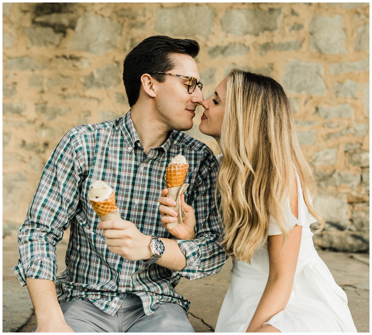 Atlanta, Georgia engagement session of a young couple kissing and eating ice cream together on the Atlanta Beltline
