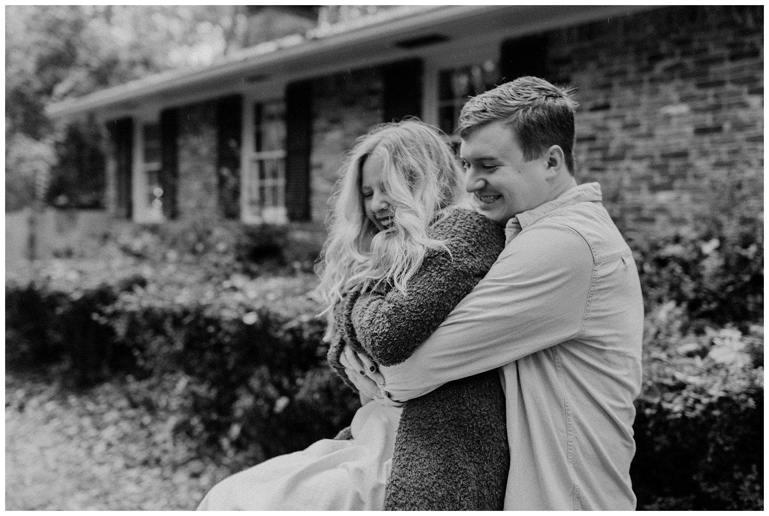 Rainy Day Engagement Session in Marietta, Georgia with cute couple laughing in the rain