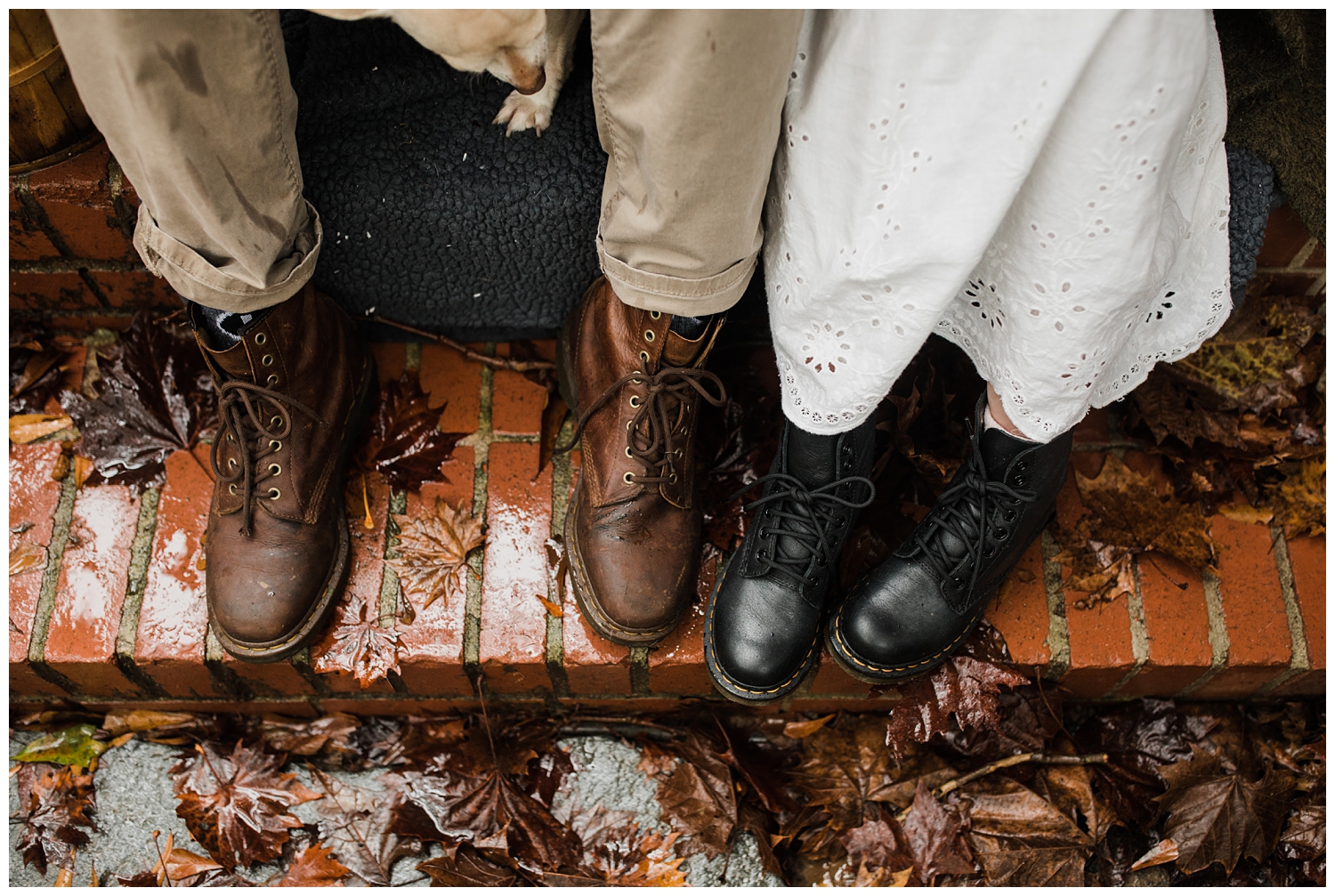 Rainy Day Engagement Session in Marietta, Georgia with cute couple sitting on their front porch with their two rescue dogs